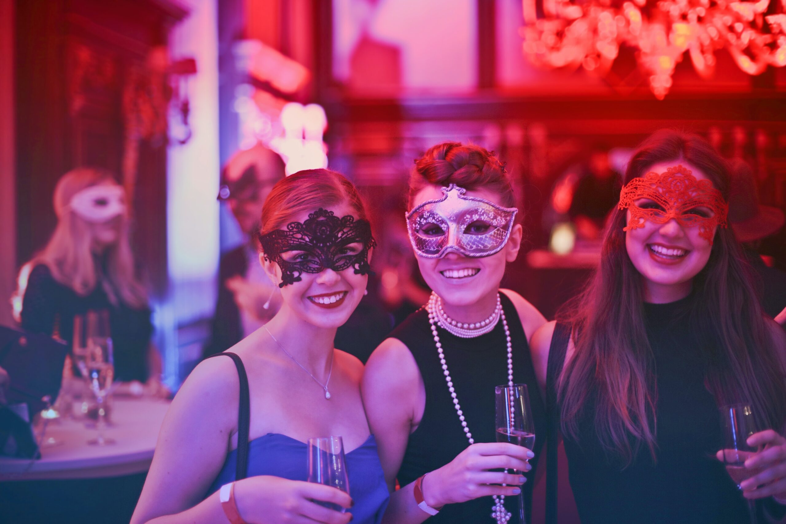 A group of friends laughing and dancing at a trendy night club in Delhi, with colorful lights and a lively atmosphere.